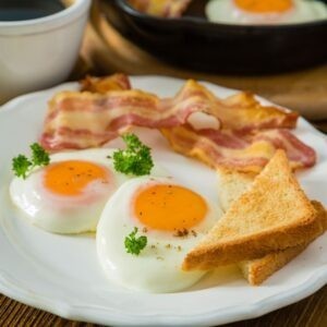 sunny side up eggs with toast and bacon
